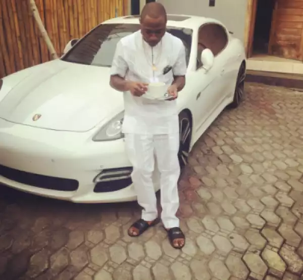 Photo: Davido Sips Tea In Front Of His Car Before Leaving For His Meetings